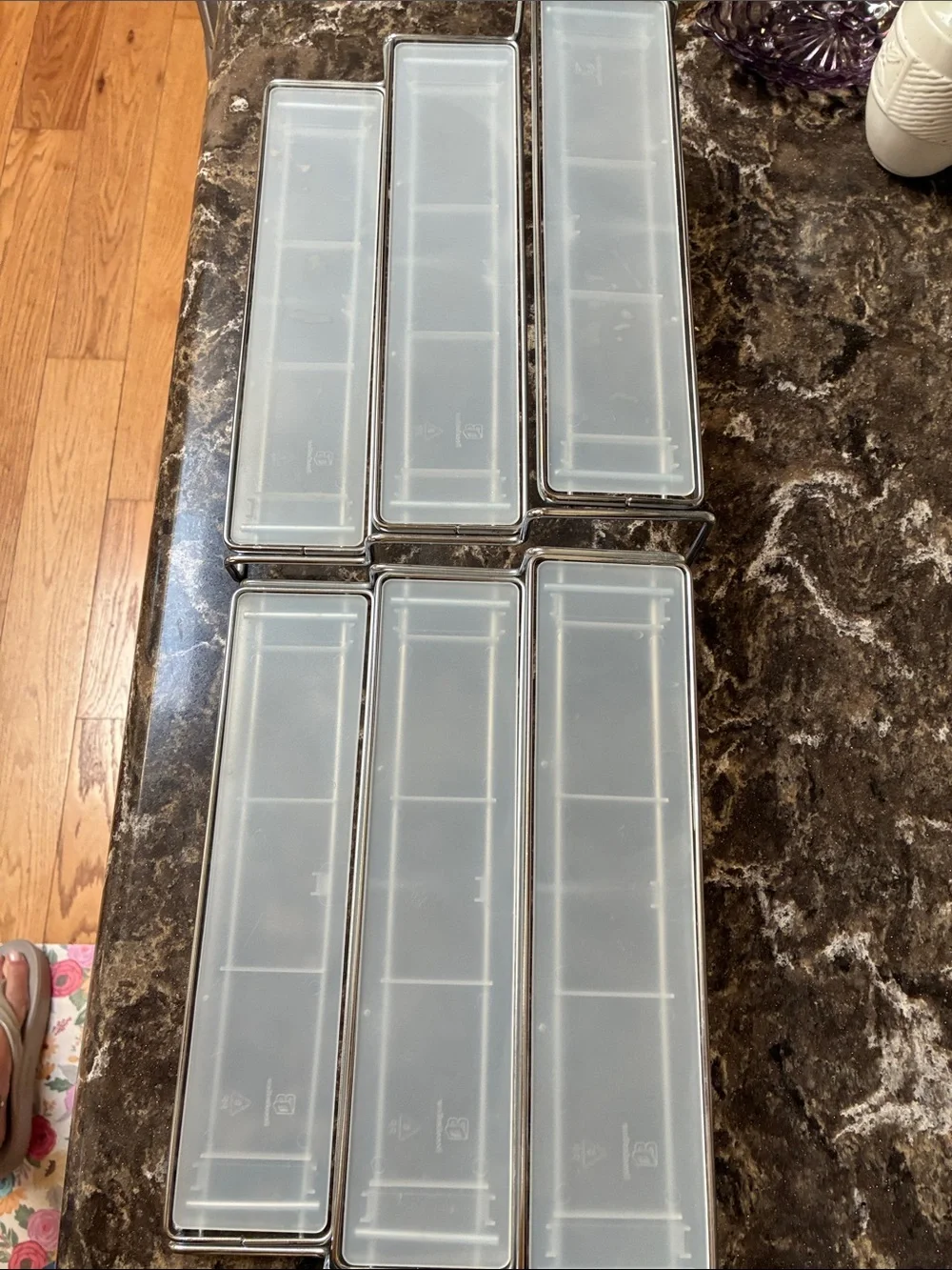 Clear plastic & metal display shelves slide together